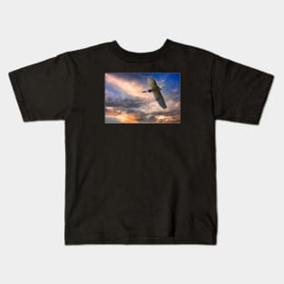 A White Egret Flies Off Under An Evening Sky Kids T-Shirt